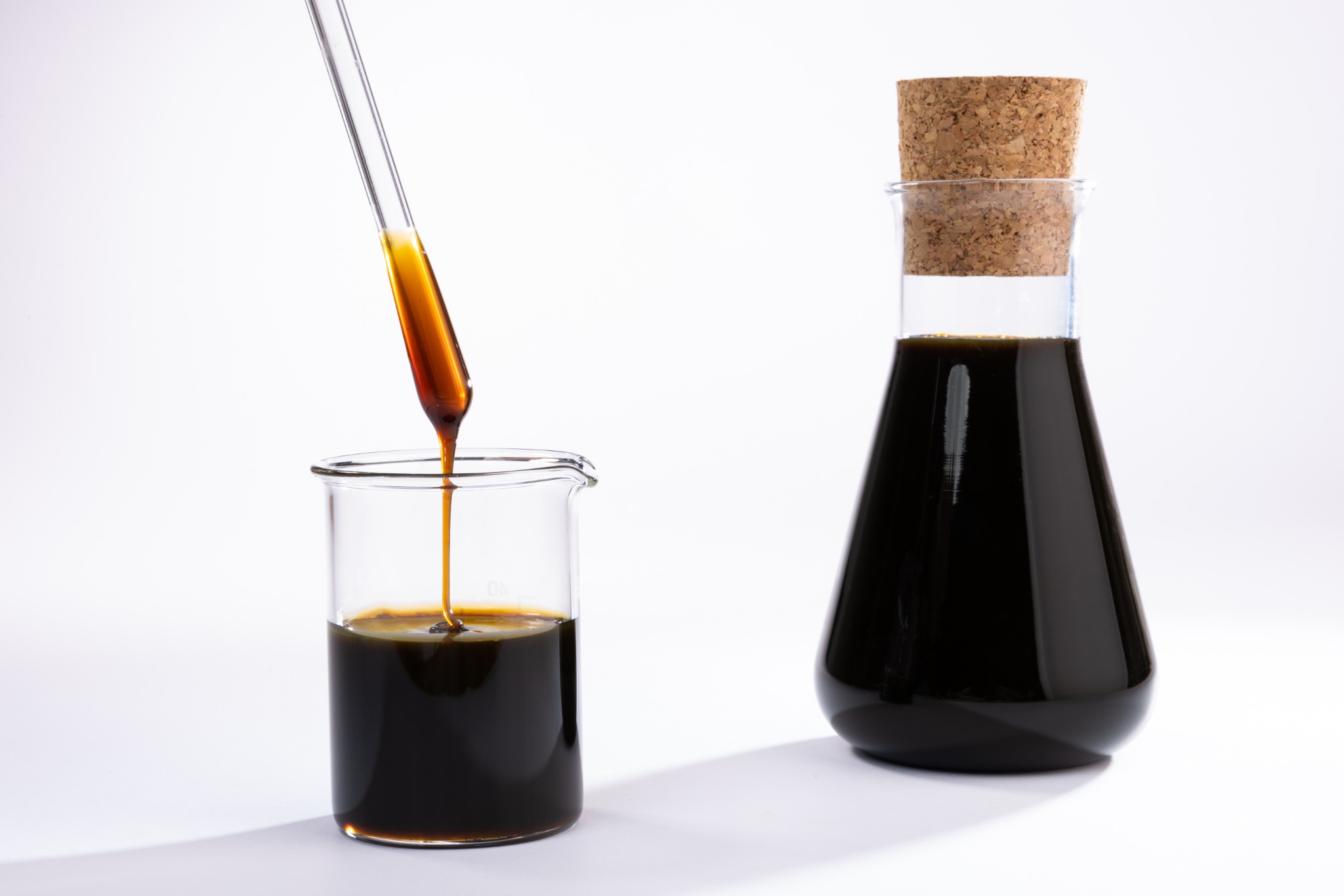 Crude sunflower lecithin sample in laboratory glassware